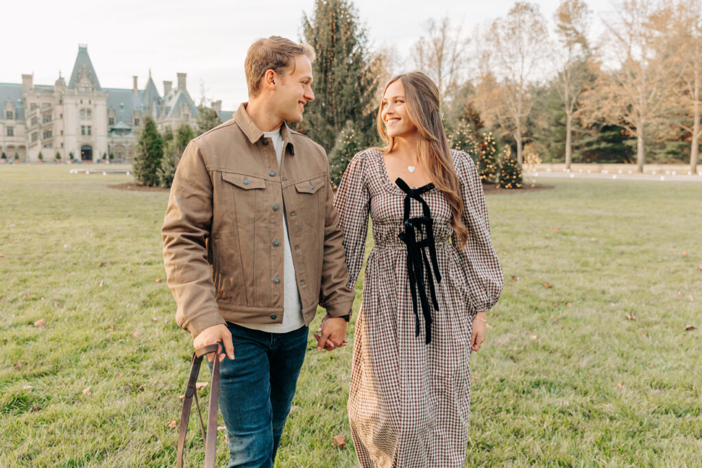 Couples family session with golden retriever dog at the Biltmore Estate at Christmas in Asheville, NC with Rachel Marie Photography