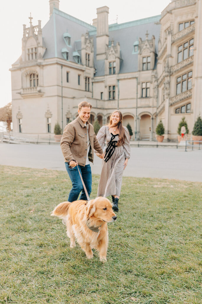 Couples family session with golden retriever dog at the Biltmore Estate at Christmas in Asheville, NC with Rachel Marie Photography