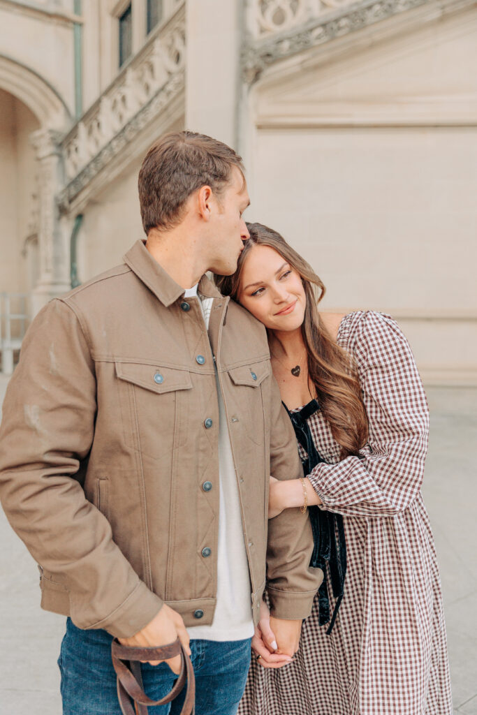 Couples family session with golden retriever dog at the Biltmore Estate at Christmas in Asheville, NC with Rachel Marie Photography