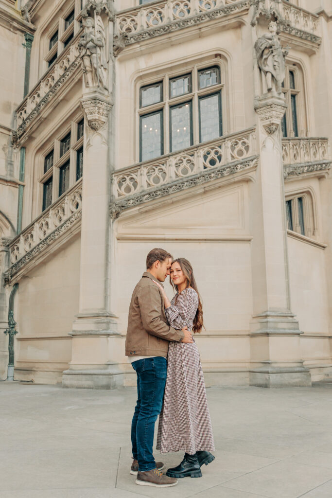 Couples family session with golden retriever dog at the Biltmore Estate at Christmas in Asheville, NC with Rachel Marie Photography