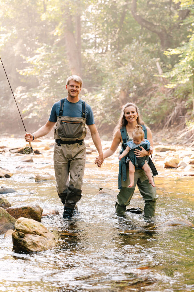 Family goes fly fishing together in the Davidson River in Brevard, North Carolina near Hendersonville and Asheville, NC and is photographed by family photographer Rachel Marie Photography