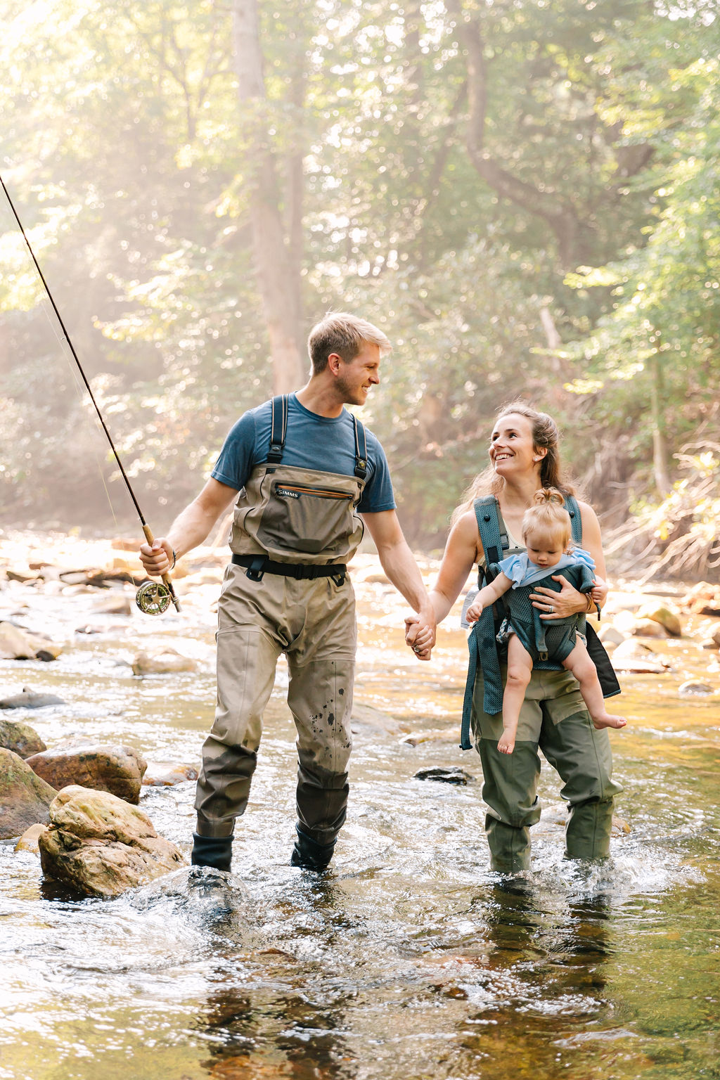 Family goes fly fishing together in the Davidson River in Brevard, North Carolina near Hendersonville and Asheville, NC and is photographed by family photographer Rachel Marie Photography