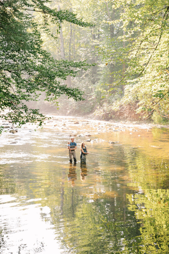 Family goes fly fishing together in the Davidson River in Brevard, North Carolina near Hendersonville and Asheville, NC and is photographed by asheville family photographer Rachel Marie Photography