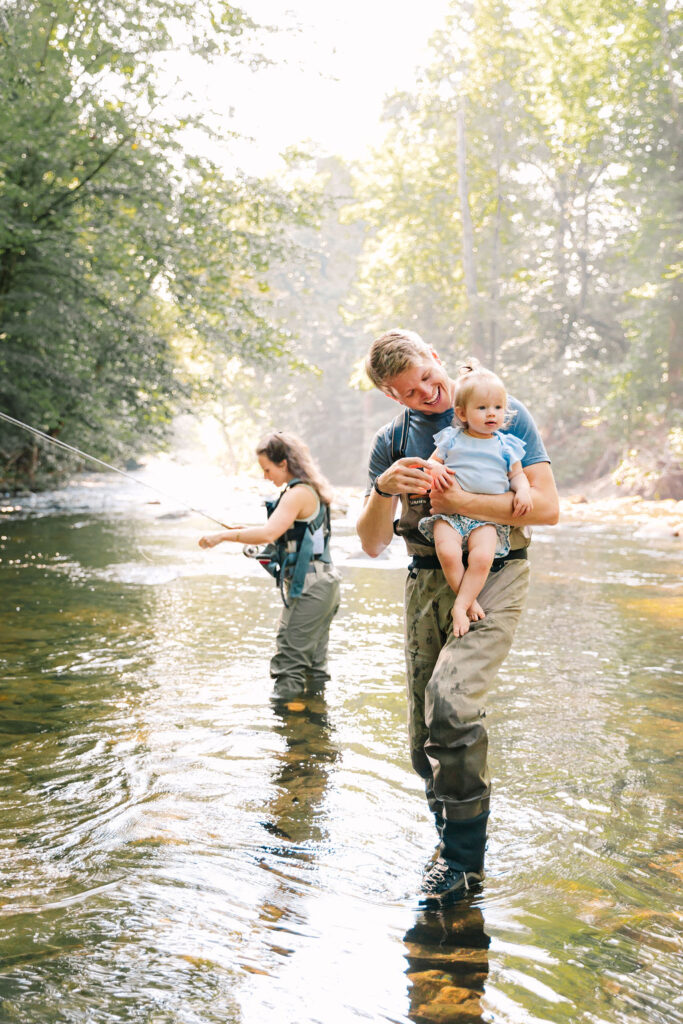Family goes fly fishing together in the Davidson River in Brevard, North Carolina near Hendersonville and Asheville, NC and is photographed by asheville family photographer Rachel Marie Photography