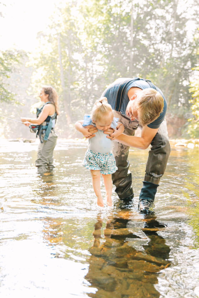 Family goes fly fishing together in the Davidson River in Brevard, North Carolina near Hendersonville and Asheville, NC and is photographed by asheville family photographer Rachel Marie Photography