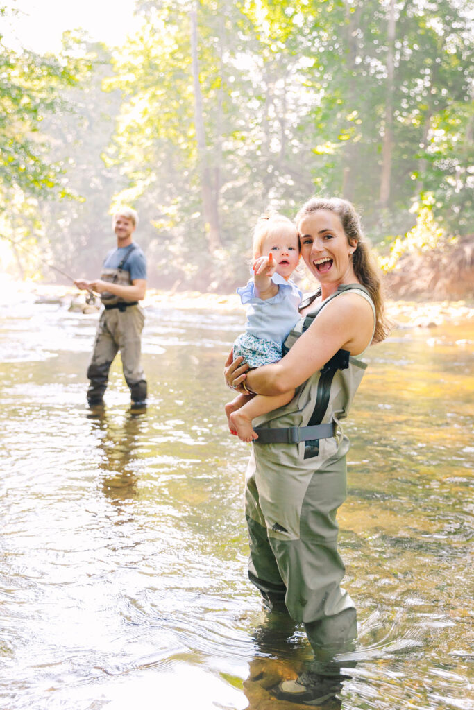 Family goes fly fishing together in the Davidson River in Brevard, North Carolina near Hendersonville and Asheville, NC and is photographed by asheville family photographer Rachel Marie Photography
