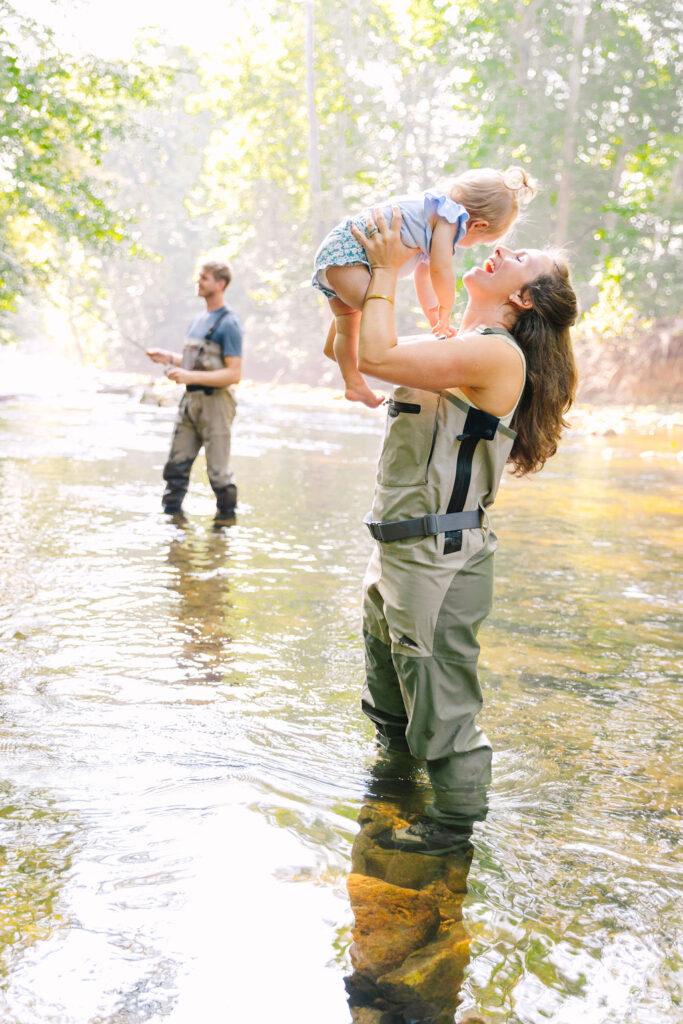 Family goes fly fishing together in the Davidson River in Brevard, North Carolina near Hendersonville and Asheville, NC and is photographed by asheville family photographer Rachel Marie Photography