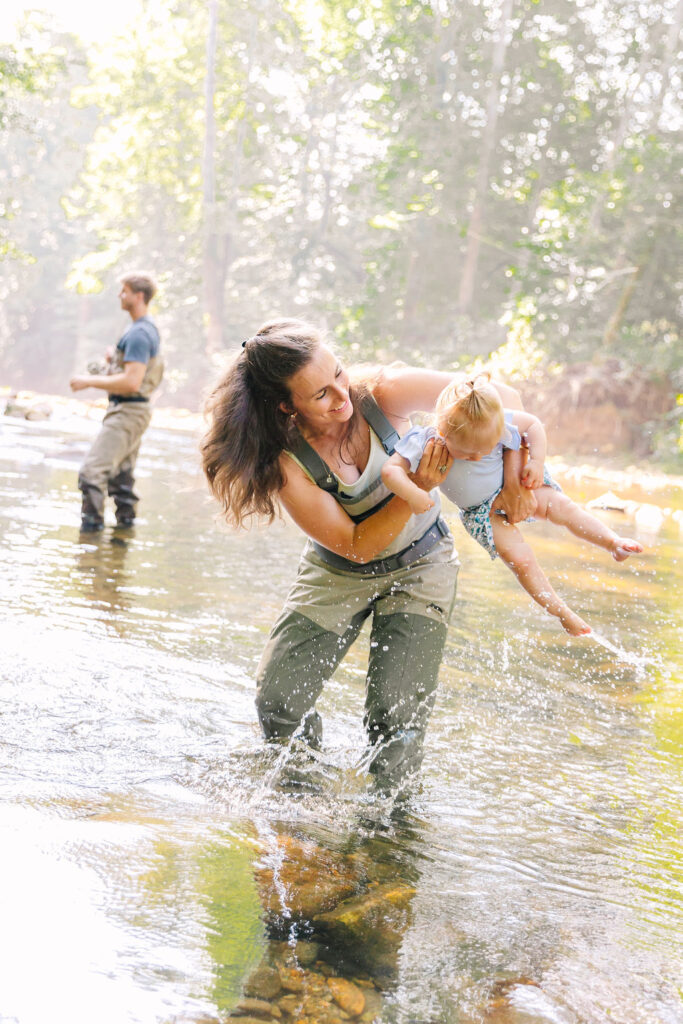 Family goes fly fishing together in the Davidson River in Brevard, North Carolina near Hendersonville and Asheville, NC and is photographed by asheville family photographer Rachel Marie Photography