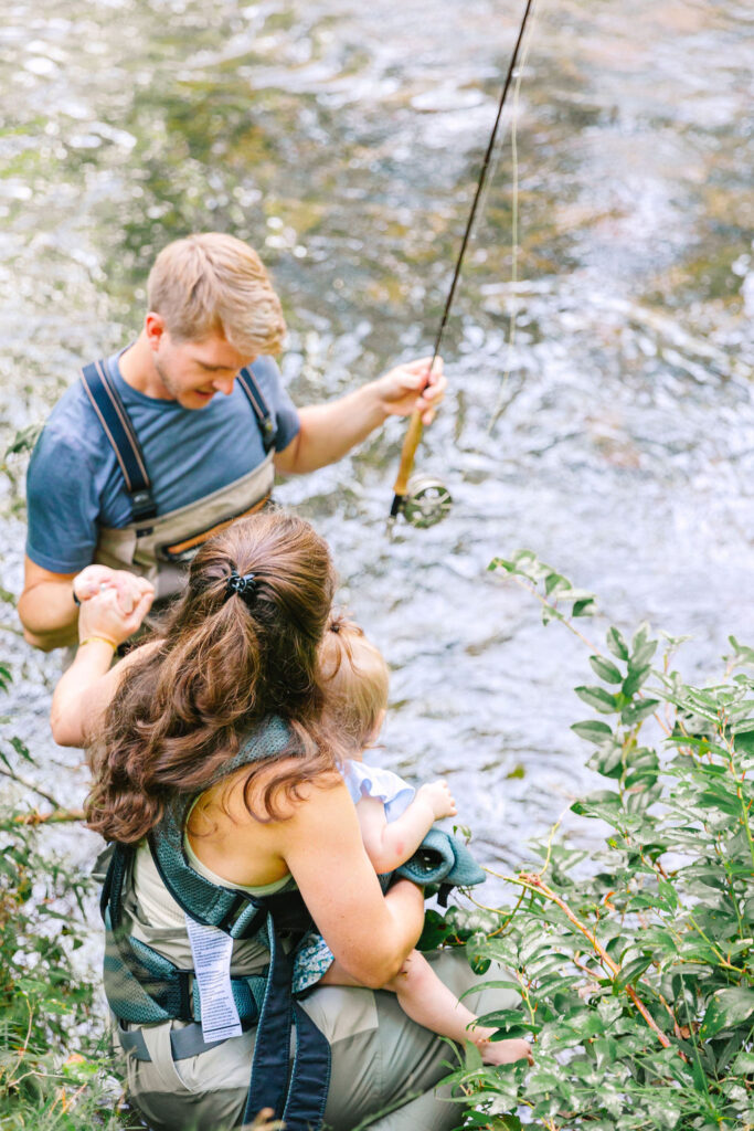 Family goes fly fishing together in the Davidson River in Brevard, North Carolina near Hendersonville and Asheville, NC and is photographed by asheville family photographer Rachel Marie Photography