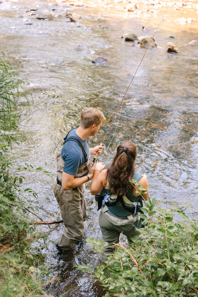 Family goes fly fishing together in the Davidson River in Brevard, North Carolina near Hendersonville and Asheville, NC and is photographed by family photographer Rachel Marie Photography