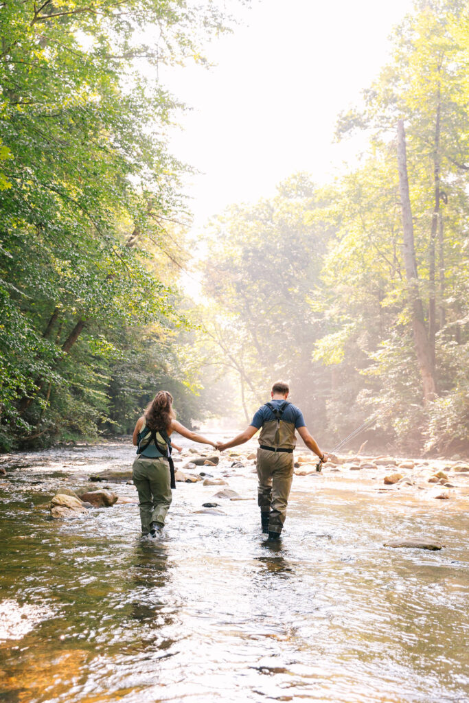 Family goes fly fishing together in the Davidson River in Brevard, North Carolina near Hendersonville and Asheville, NC and is photographed by family photographer Rachel Marie Photography