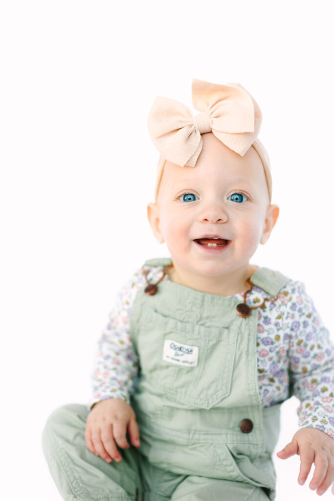 baby girl personality portraits in white backdrop studio with Rachel Marie Photography a family photographer in Asheville, NC