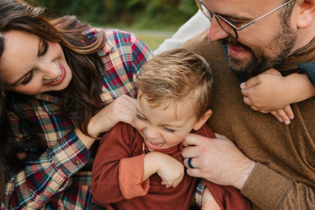 family tickles during fall family photo session on the Blue Ridge Parkway in Asheville, North Carolina with family photographer Rachel Marie Photography