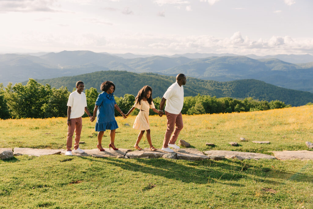 sunset mountain view family adventure photo session at Bear Wallow Mountain in Hendersonville, NC with family with two teenagers