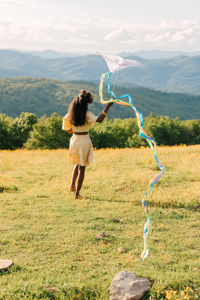 sunset mountain view family adventure photo session at Bear Wallow Mountain in Hendersonville, NC with family with two teenagers