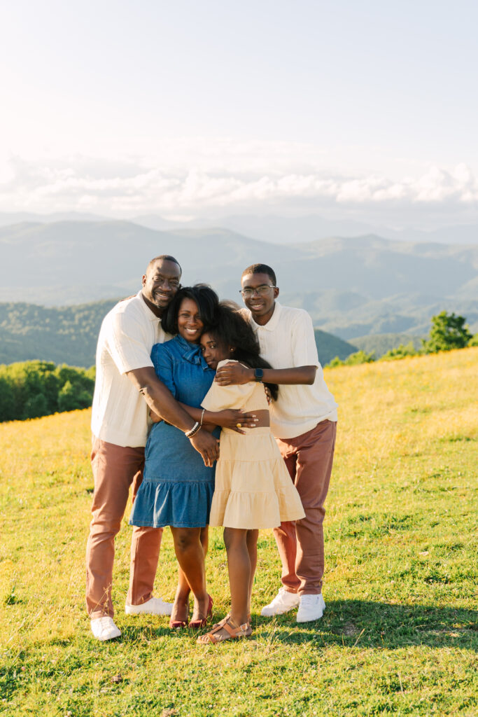 sunset mountain view family adventure photo session at Bear Wallow Mountain in Hendersonville, NC with family with two teenagers