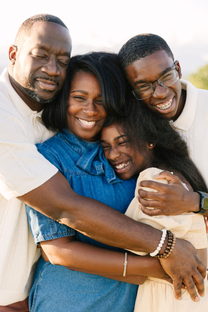 sunset mountain view family adventure photo session at Bear Wallow Mountain in Hendersonville, NC with family with two teenagers