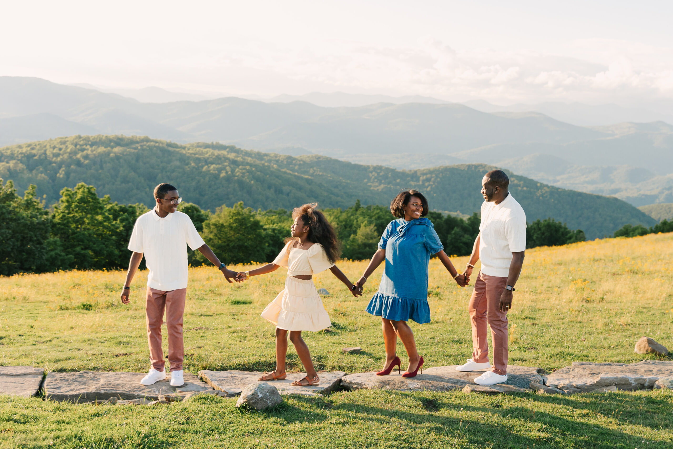 sunset mountain view family adventure photo session at Bear Wallow Mountain in Hendersonville, NC with family with two teenagers
