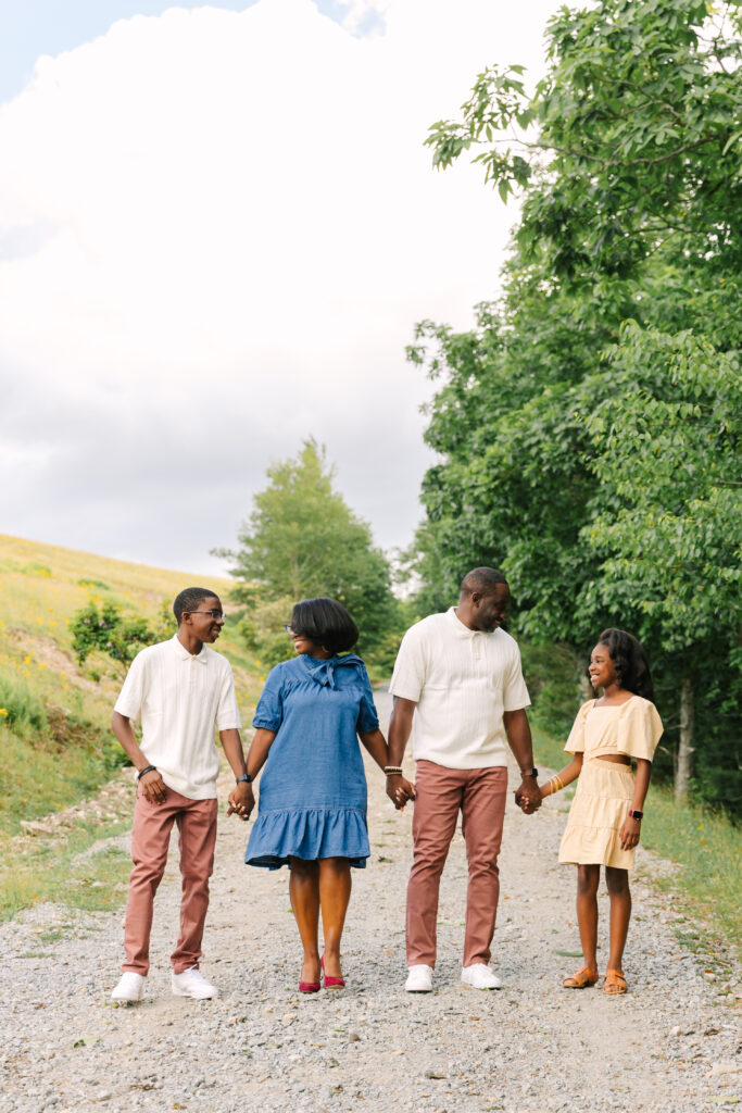 sunset mountain view family adventure photo session at Bear Wallow Mountain in Hendersonville, NC with family with two teenagers