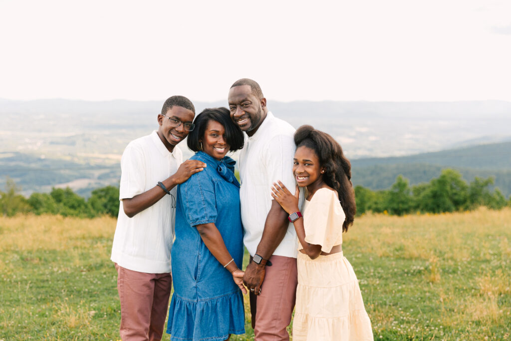 sunset mountain view family adventure photo session at Bear Wallow Mountain in Hendersonville, NC with family with two teenagers