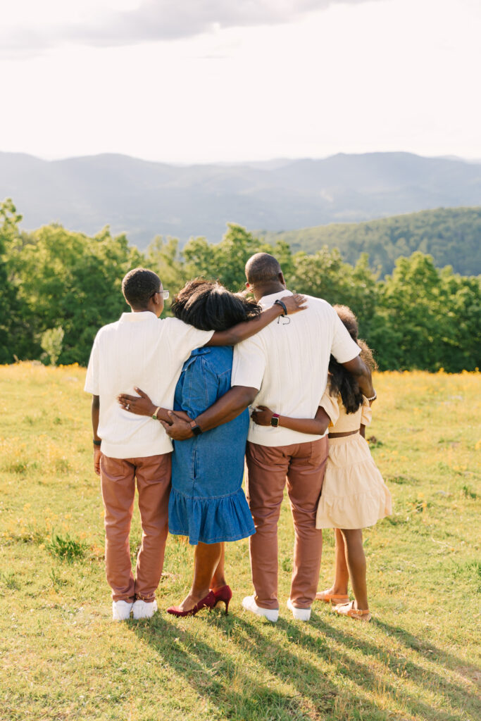 sunset mountain view family adventure photo session at Bear Wallow Mountain in Hendersonville, NC with family with two teenagers