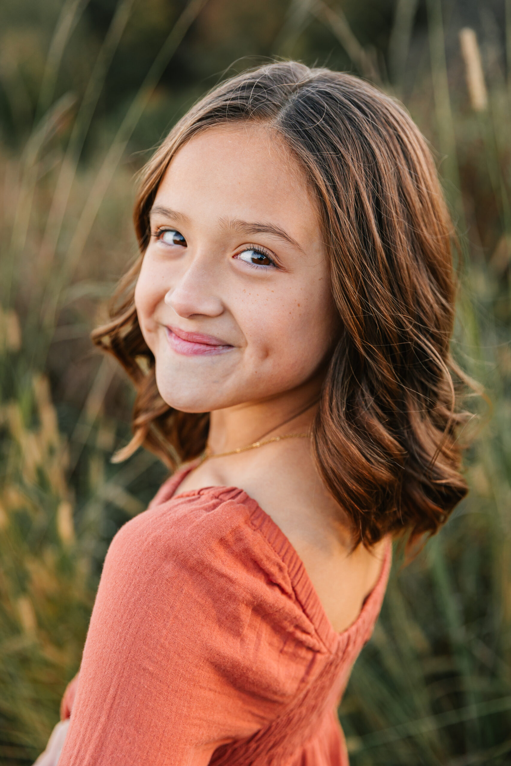 Girl poses for fall family photos with Asheville Family Photographer, Rachel Marie Photography