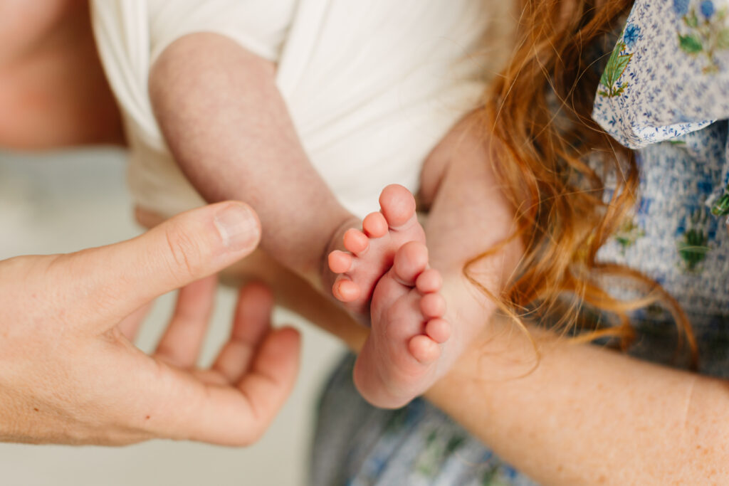 close up of baby's feet during newborn photo session