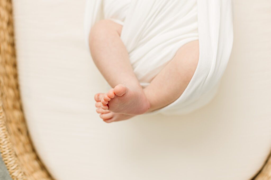 Newborn baby boy in swaddle during in-home newborn session with Rachel Marie Photography, a Newborn Photographer in the Asheville and Hendersonville area