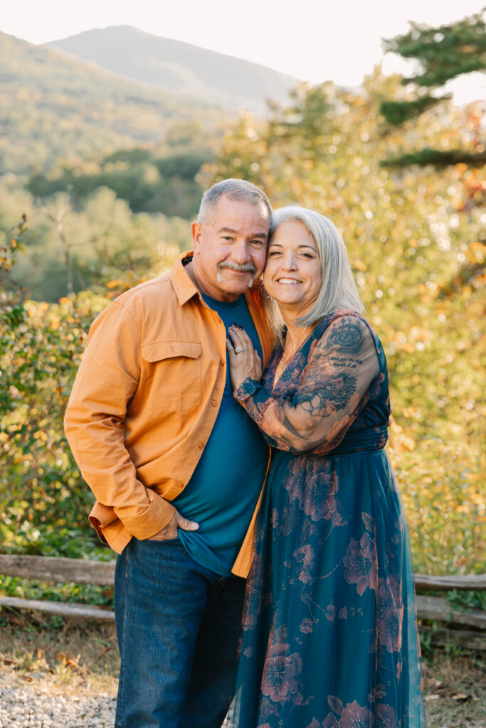 grandma and grandpa smile together during extended family photo session in Asheville, NC with family photographer Rachel Marie Photography