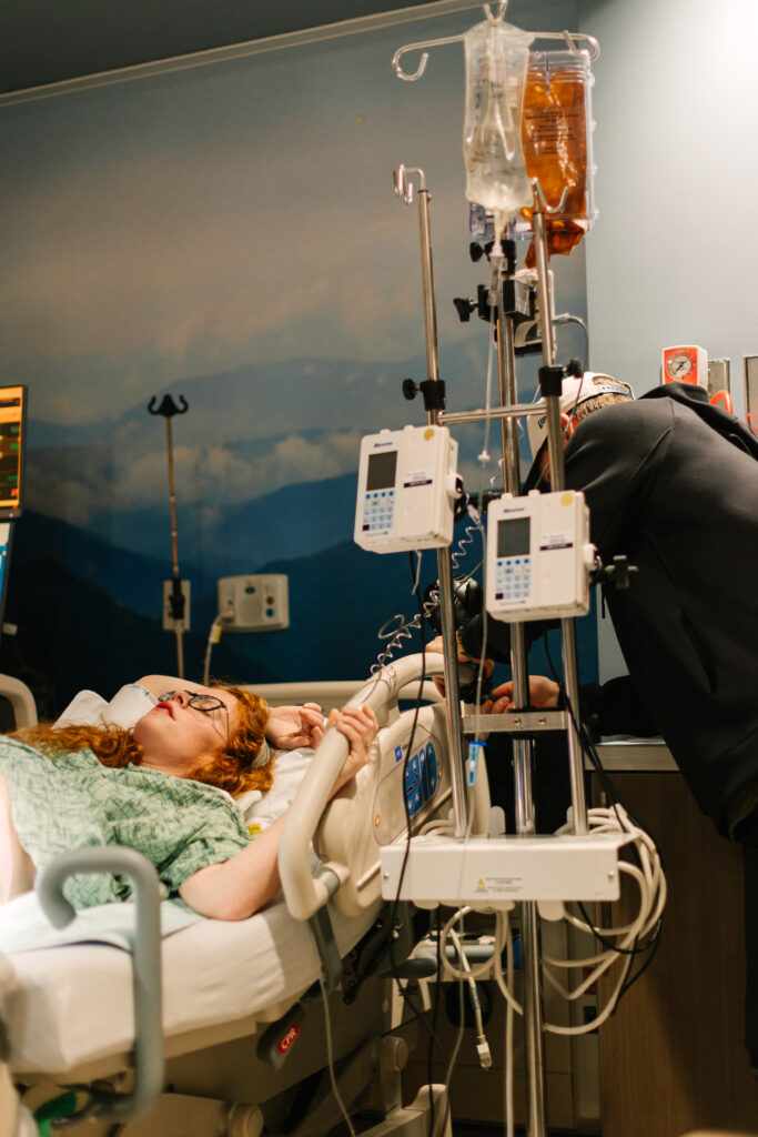 pregnant mother in labor at mission hospital in Asheville, NC during birth photography session with Rachel Marie Photography