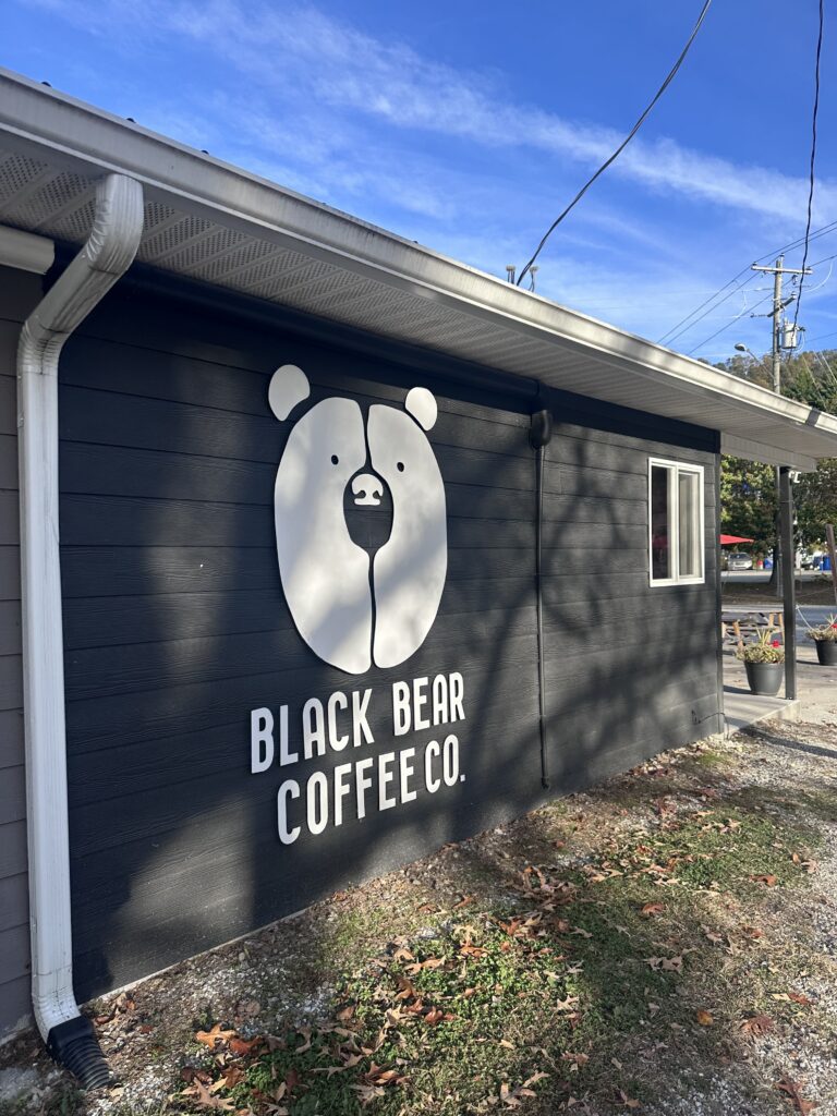 store front of Black Bear Coffee Co in Fairvew, NC with black bear statue
