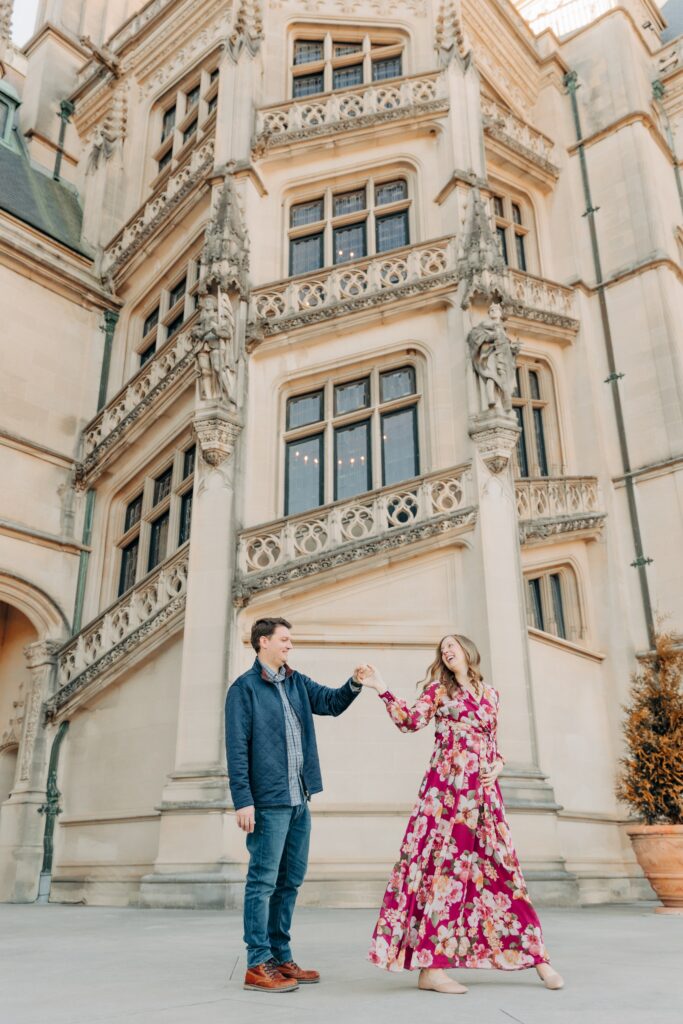 Pregnant couple dances during Biltmore Estate Maternity Photo Session with Asheville Maternity Photographer, Rachel Marie Photography