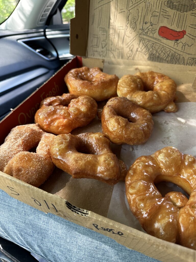 a box full of the vanilla glazed doughnuts from Hole Doughnuts in West Asheville, recommended by Asheville Family Photographer Rachel Marie Photography